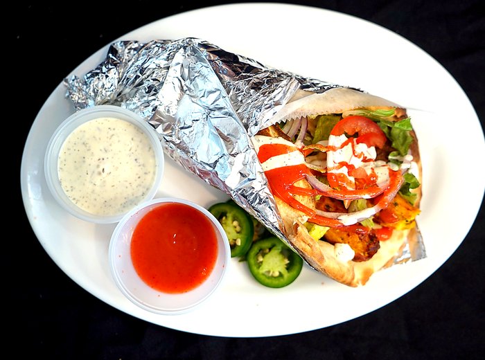 Chicken gyro with sauces at Shalimar Restaurant